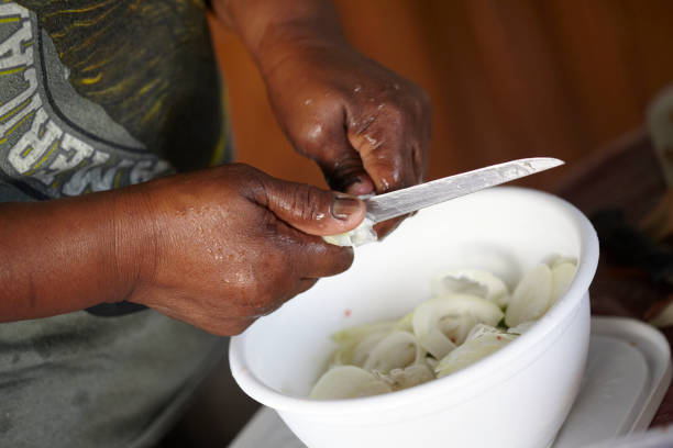 istock Lady Prepares Vegetables For Caribbean Soup 923910810