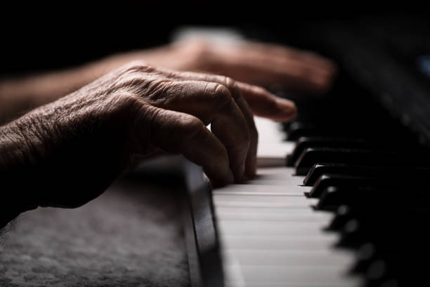 istock Senior playing the piano 923921126