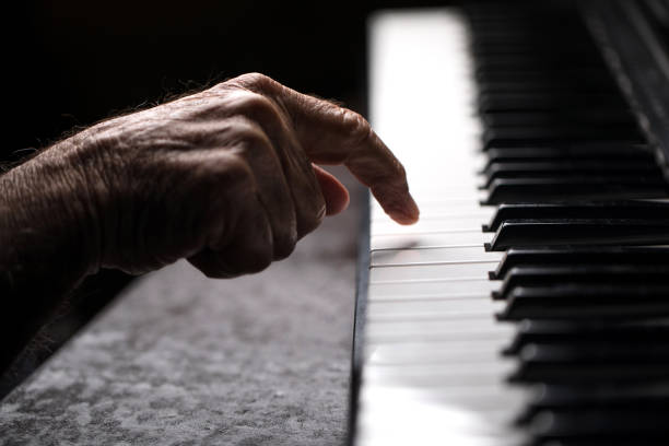 istock Senior playing the piano 923921134