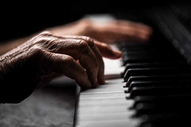 istock Senior playing the piano 923921136