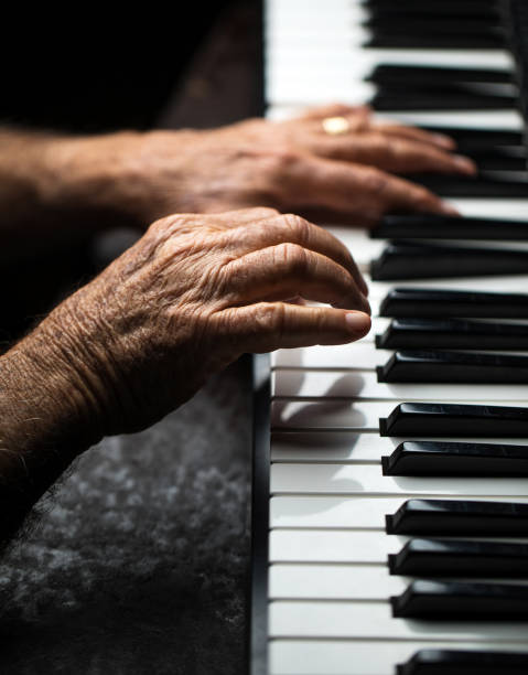 istock Senior playing the piano 923921194