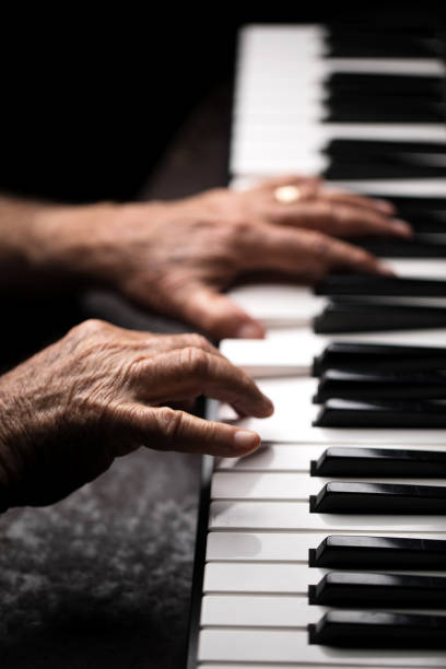 istock Senior playing the piano 923921210