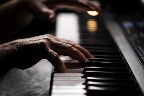 istock Senior playing the piano 923923224