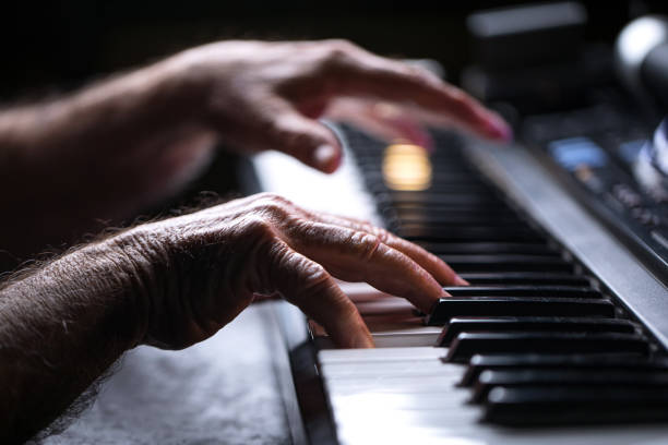 istock Senior playing the piano 923923230