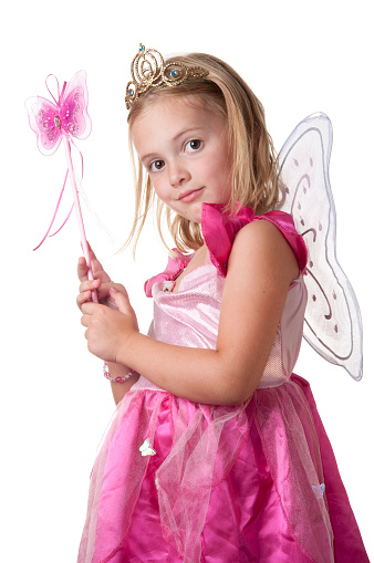 Pink fairy princess looks over her shoulder at the camera.