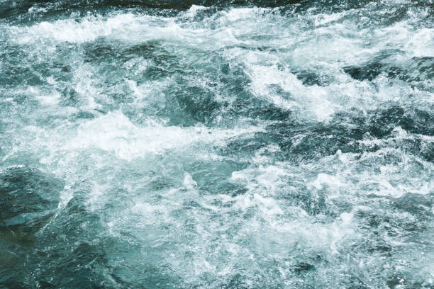istock Texture of water wave in stream, aqua surface, background. 923935944