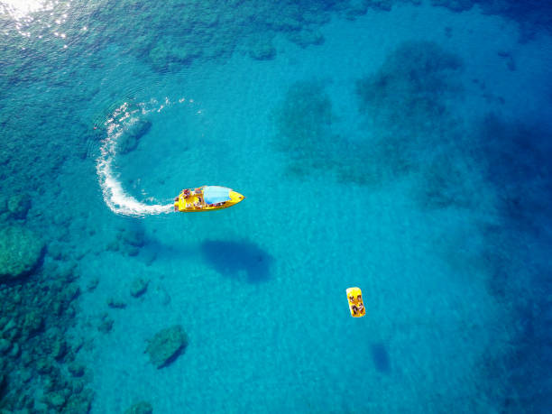 istock Speed boat with paddle boat on the beautiful sea. 923939748