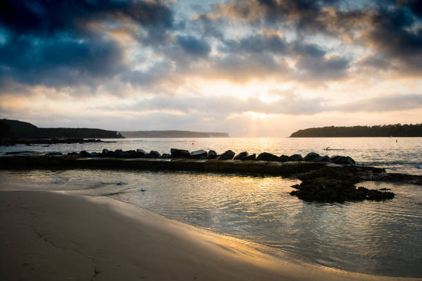 istock Rocky outcrop on beach at sunrise 923952018