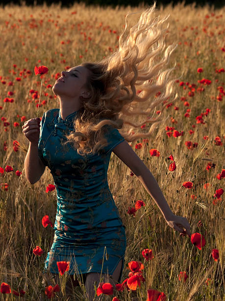 istock Blonde in poppy field 92395282