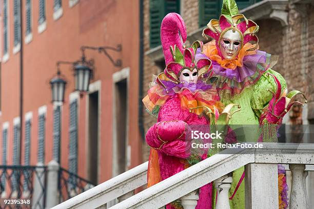 Couple Of Masks With Jester Costumes At Carnival In Venice Stock Photo - Download Image Now