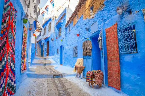 Photo of Beautiful street of blue medina in city Chefchaouen,  Morocco, Africa