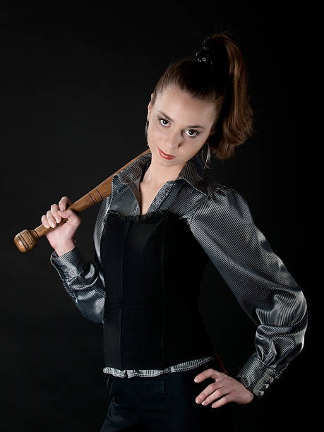 istock Young girl keeps bat and smirks 92395635