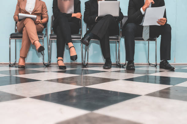 istock Four applicants  sitting on chairs and preparing for employment interview. 923959294