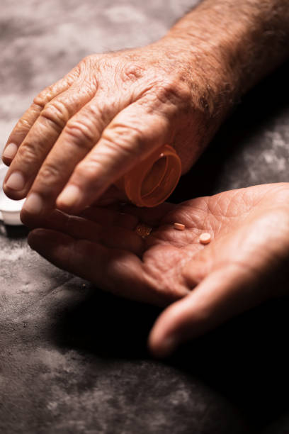 istock Senior man with medicine pills 923965120