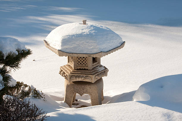 Kamakura, Japan - November 23, 2015: Japanese stone lantern at the Hasedera Temple in Kamakura, Japan. Hasedera is a temple of the Jodo sect, that is most famous for its statue of Kannon, the goddess of mercy.