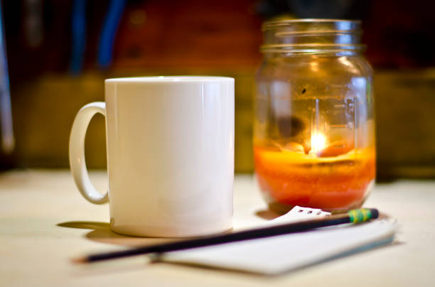 istock Blank white coffee mug on a work bench planning the job 923968644
