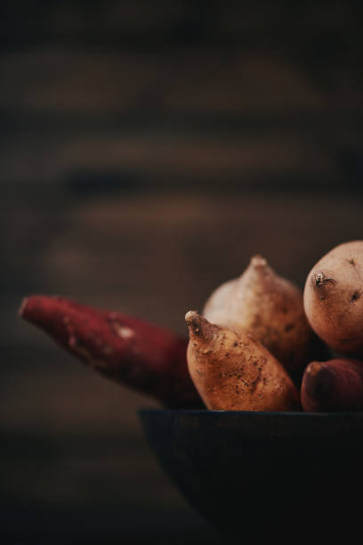 istock Still life of assorted potatoes shot in dark moody light 923977478
