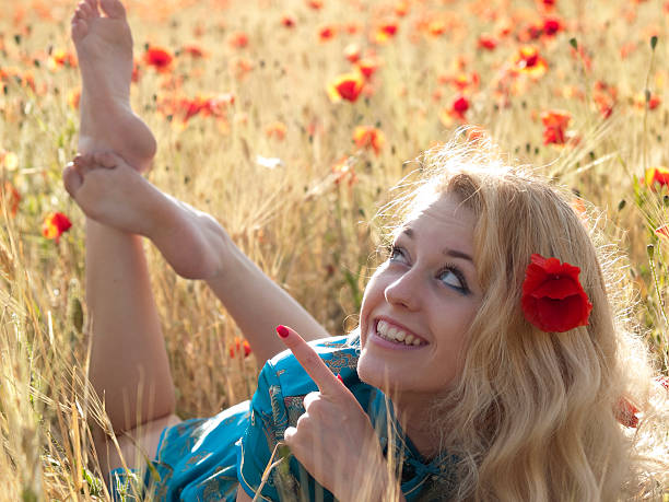 istock Barefoot blonde in poppies 92397800