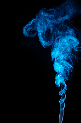 Ascending blue smoke on black background.  Vertical orientation.