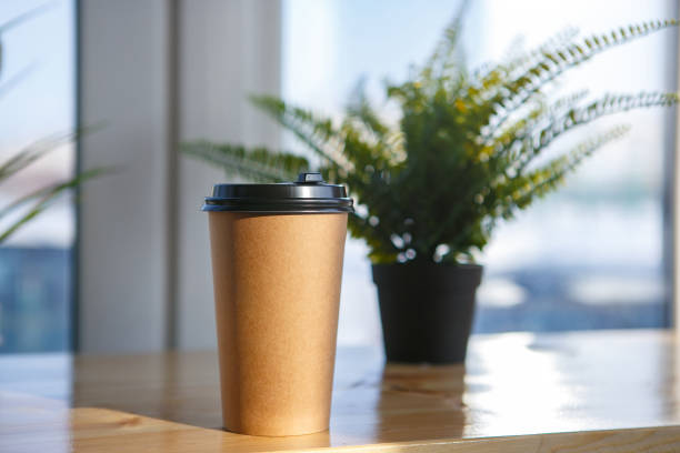 A glass of paper with a drink to take away stock photo