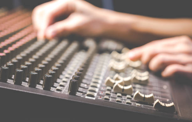 istock male sound engineer hands working on audio mixing console 923985102