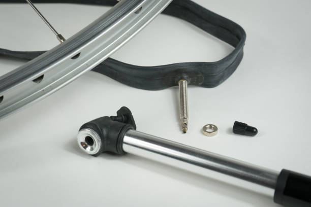 istock Flat Tire, Rim, Tube, and a Small Pump 923988094