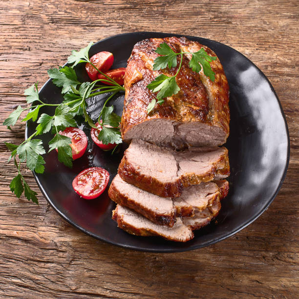 istock Roast pork with herbs and vegetables 923989000