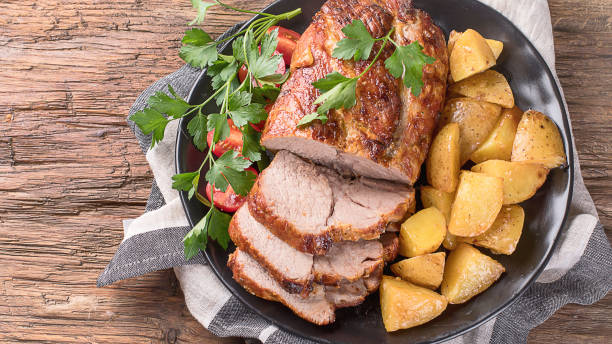 istock Roast pork with herbs and vegetables 923989002
