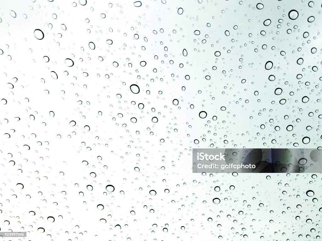 Background Photograph of raindrop on clear glass close up. Multiple Exposure Stock Photo