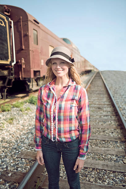 Beautiful girl on the tracks stock photo