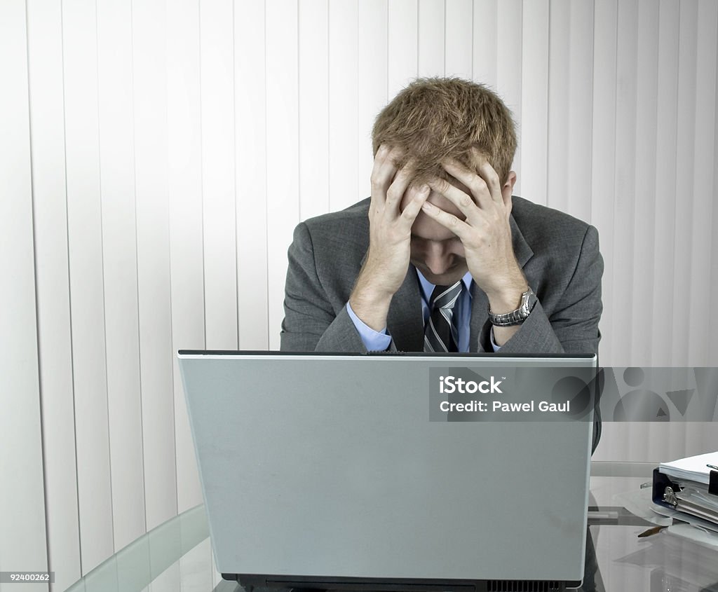 Tired man in office Bankruptcy Concept Adult Stock Photo