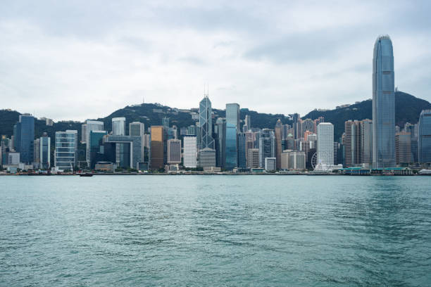 istock Hong Kong skyline against cloudy sky 924005866