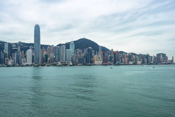 istock Hong Kong skyline against cloudy sky 924006000