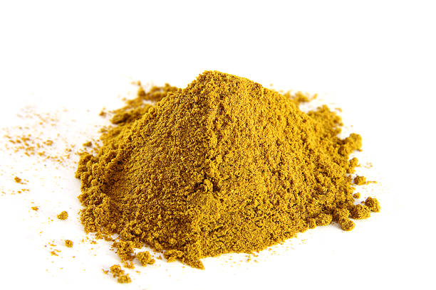 istock spices pile of curry powder on white background 92400699