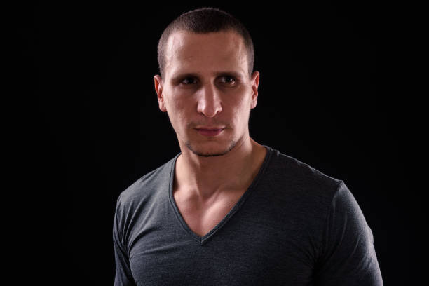 istock Portrait Of Man Against Black Background 924008084