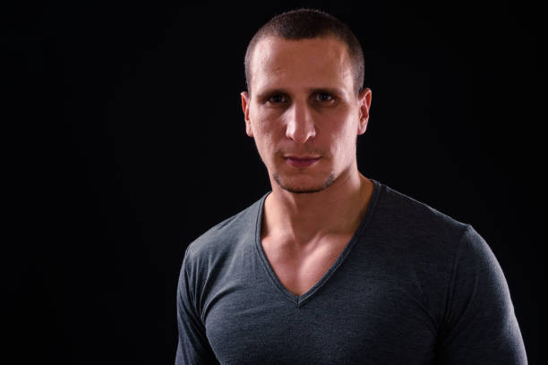 istock Portrait Of Man Against Black Background 924008130