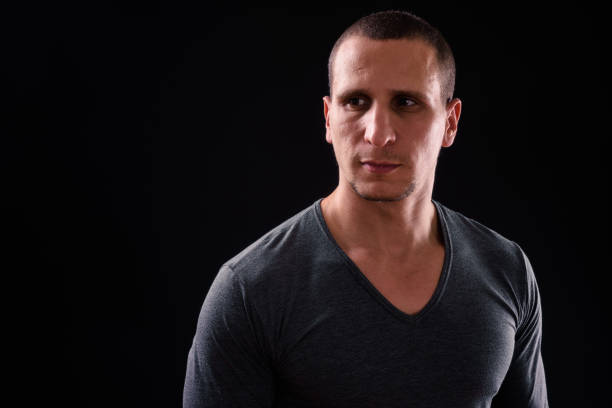 istock Portrait Of Man Against Black Background 924008166