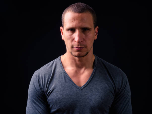 istock Portrait Of Man Against Black Background 924008170