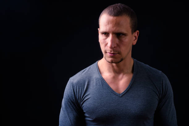 istock Portrait Of Man Against Black Background 924008212