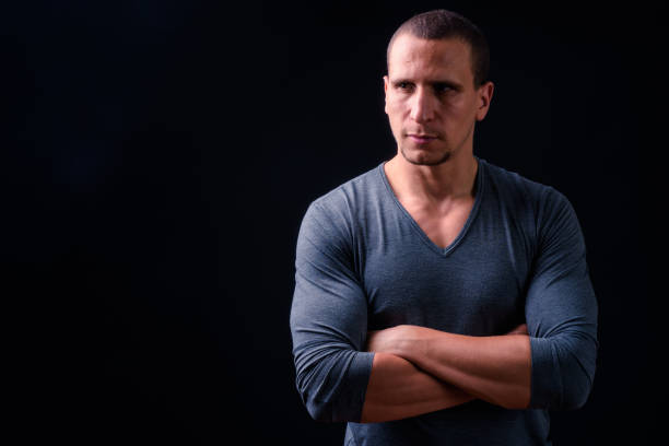 istock Portrait Of Man Against Black Background 924008214
