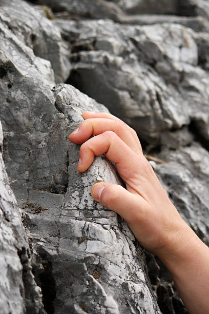 istock Hand holding tight on a rock 92400829