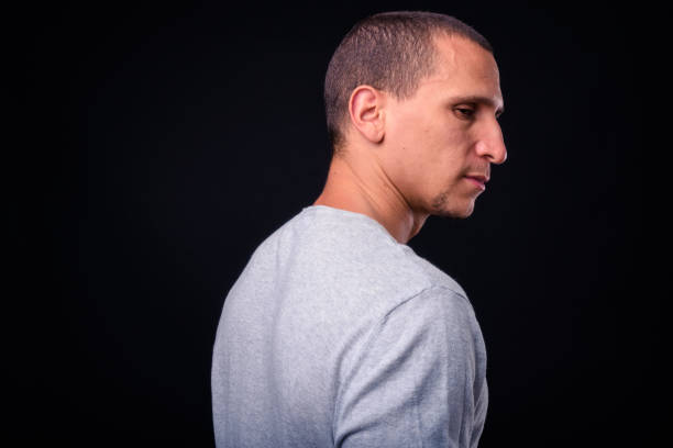 istock Portrait Of Man Against Black Background 924008362