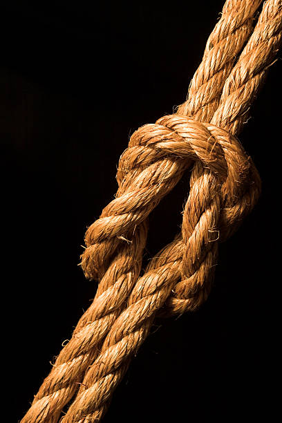 istock Thick rope tied in a knot on a black background 92401382