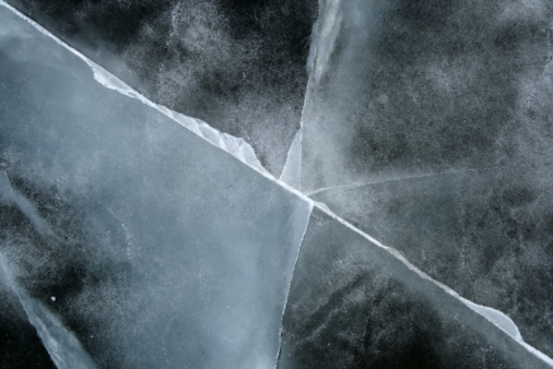 Cracked ice abstract background. Frozen river.