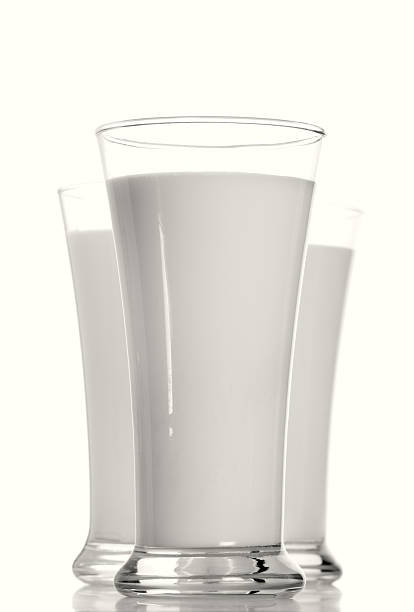 istock three milk glasses in row focus on the first one 92402614