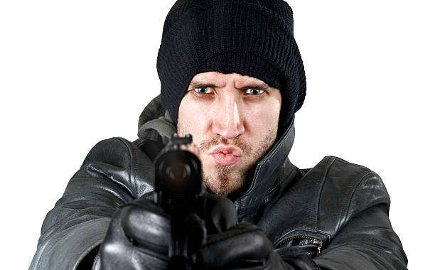 istock Undercover agent firing gun in the camera 92402756