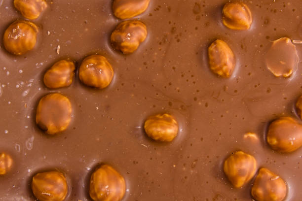 istock Background of the dark chocolate with a hazelnuts 924027864