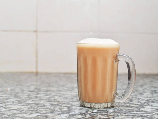 istock Teh tarik or pulled tea is a famous sweet milk tea in Malaysia. Bubble is floating on the surface of teh tarik. 924031528
