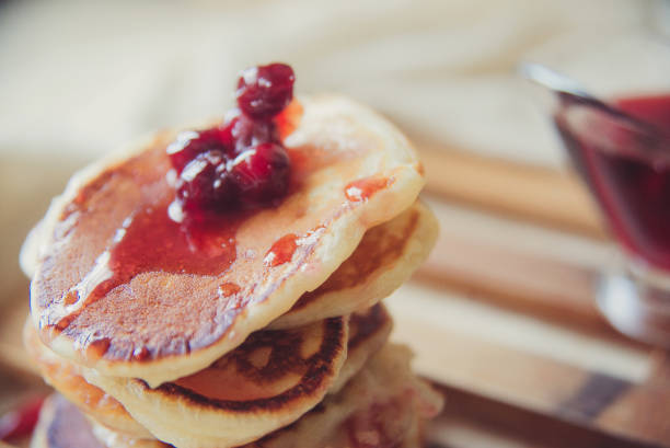 istock Blueberry pancakes on a contrasting black background. Close up 924034704