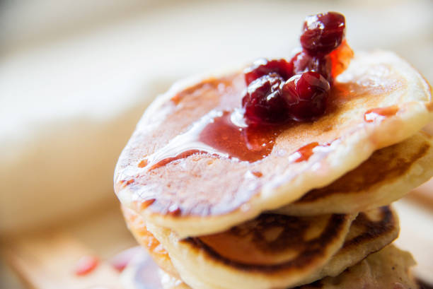 istock Blueberry pancakes on a contrasting black background. Close up 924034744